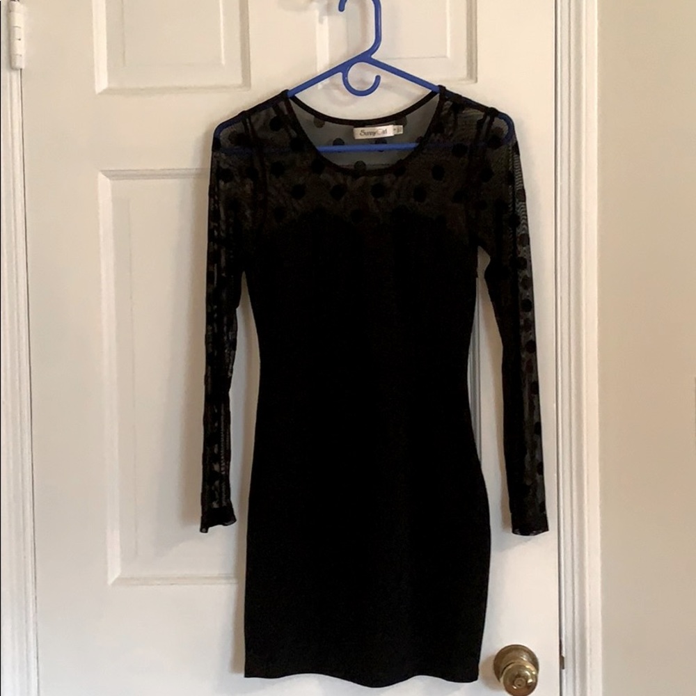 Elegant, sheer-sleeved/neckline LBD.